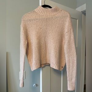 Baby pink mock neck turtleneck sweater